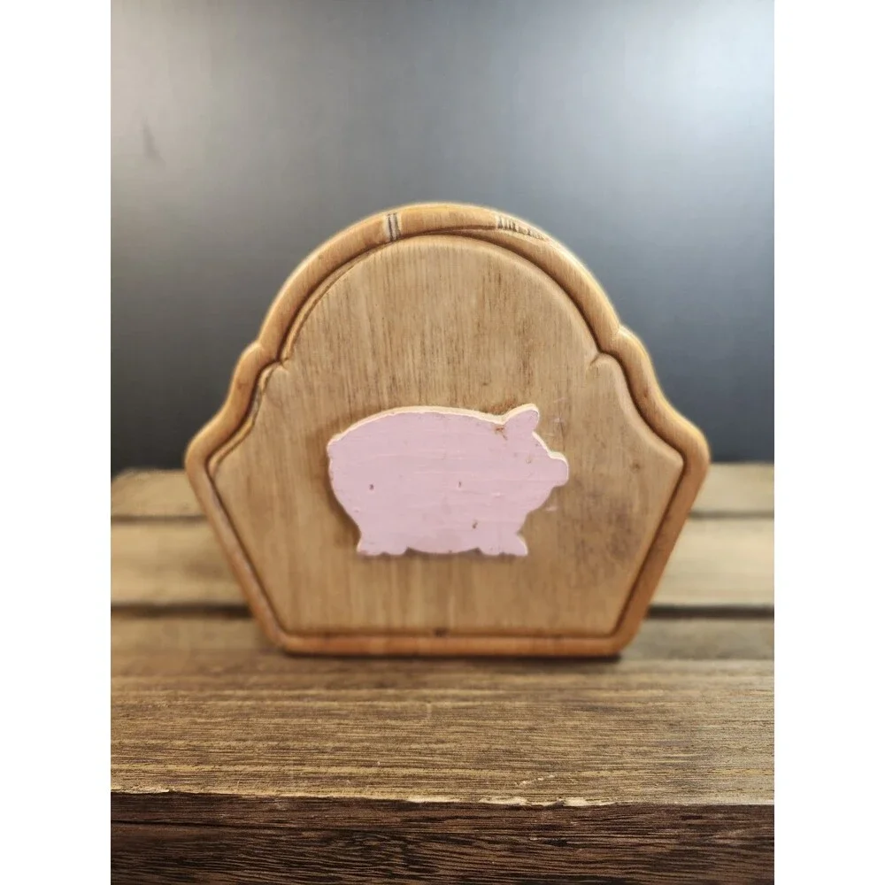 vintage wooden napkin holder features a farmhouse-style pig